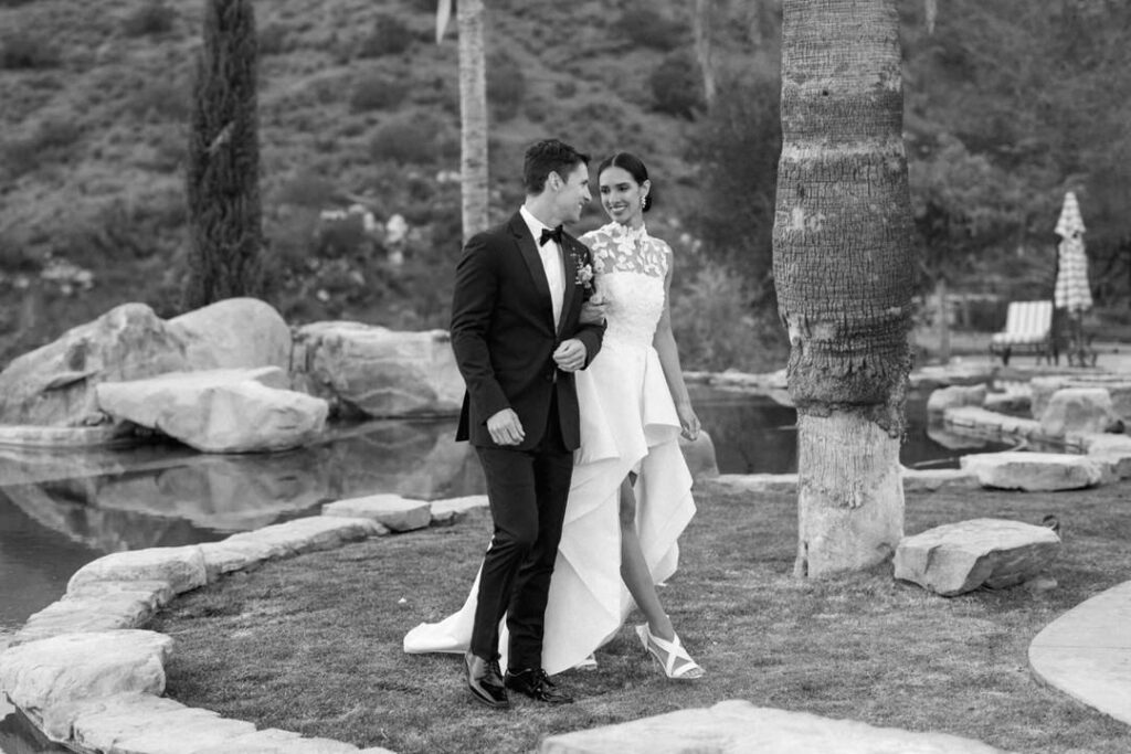 black and white of bride and groom smiling 