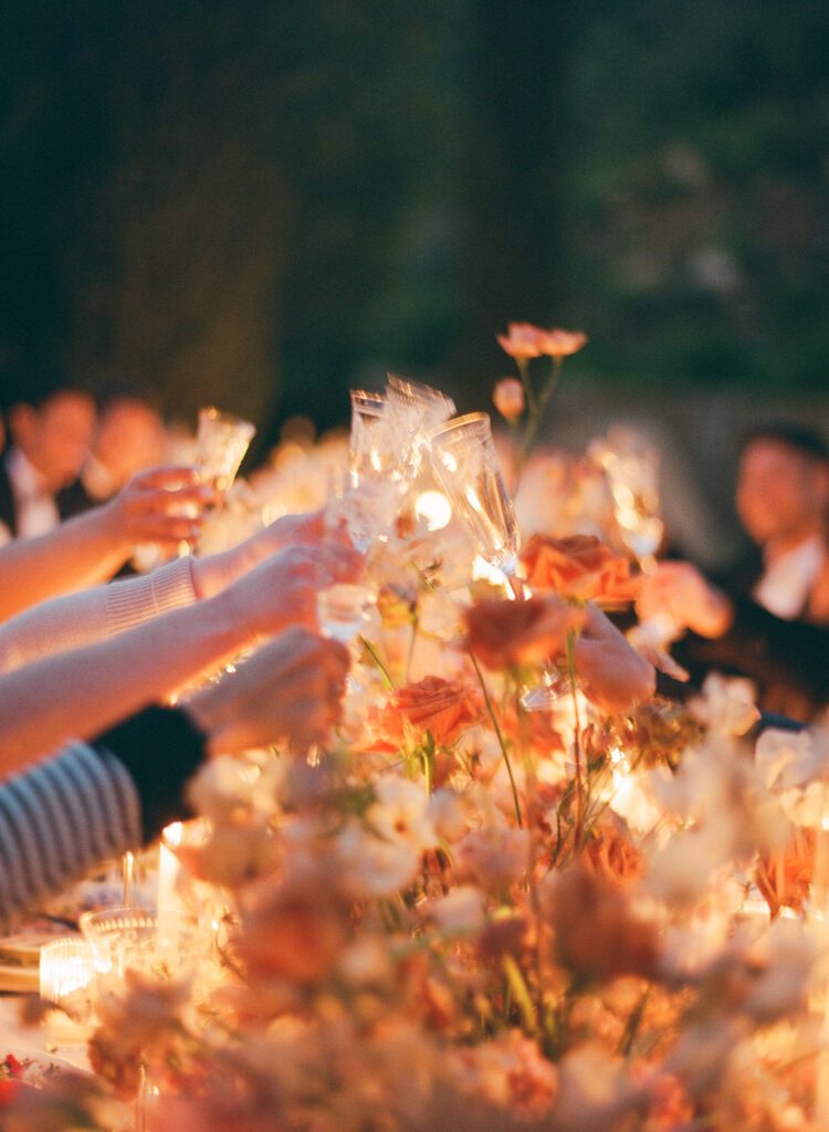 wedding reception guests toasting 