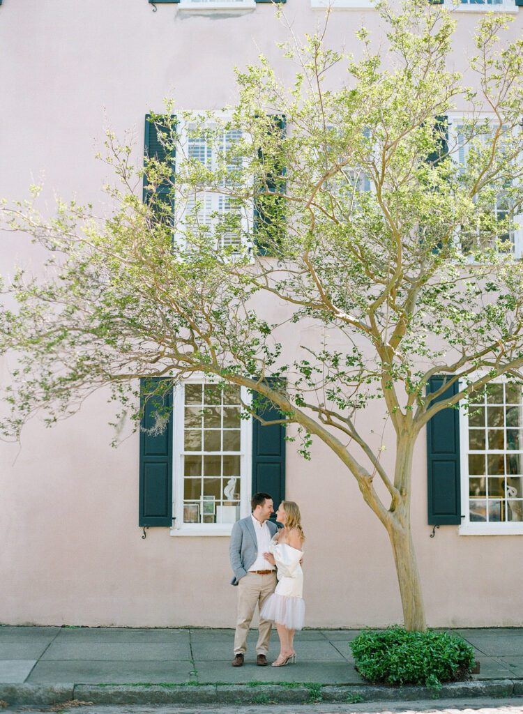 bride and groom under tree