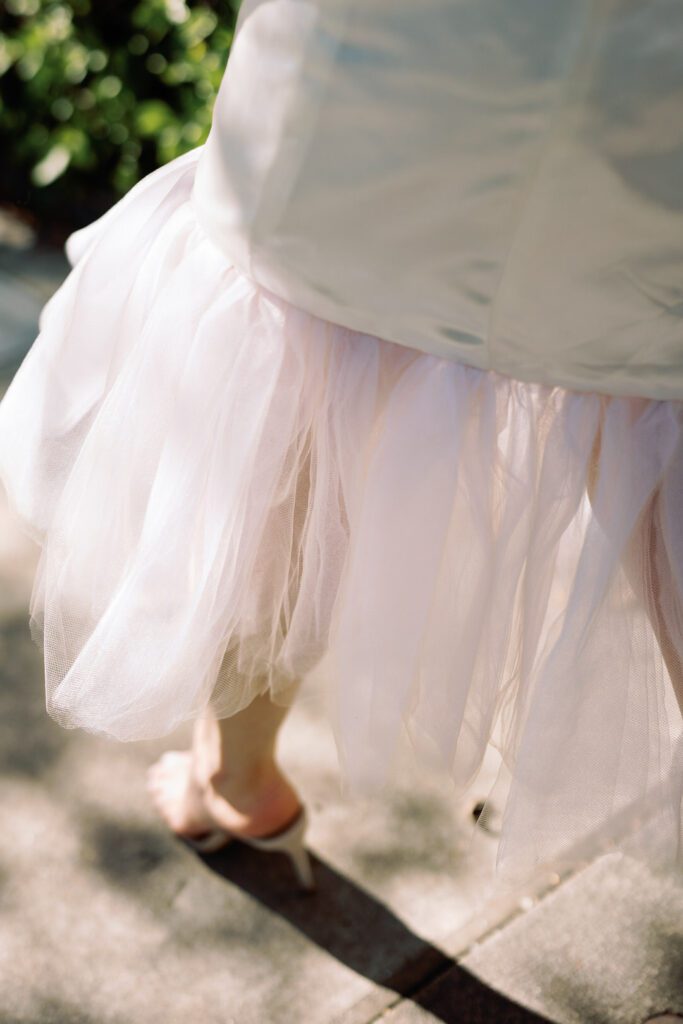 bride walking detail of dress