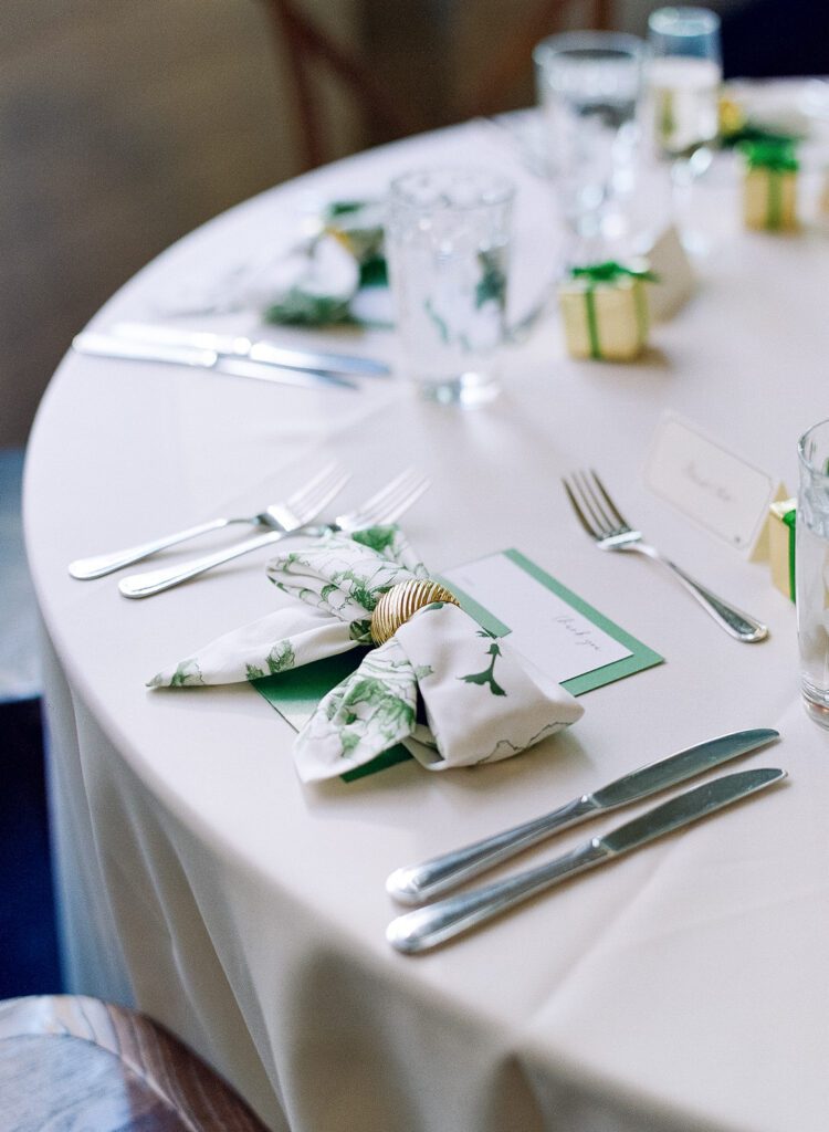 wedding rehearsal dinner table with green and white napkins at Poogan's Porch in Charleston