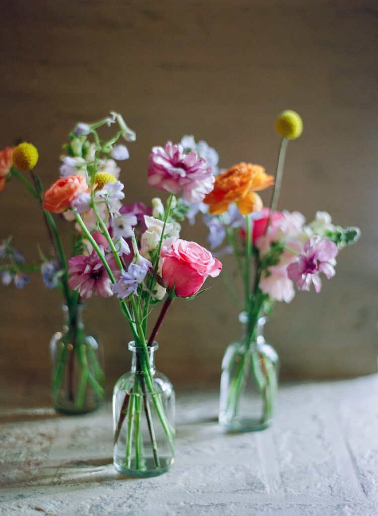 flowers in bud vases