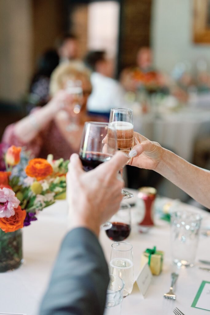 guests toasting glasses