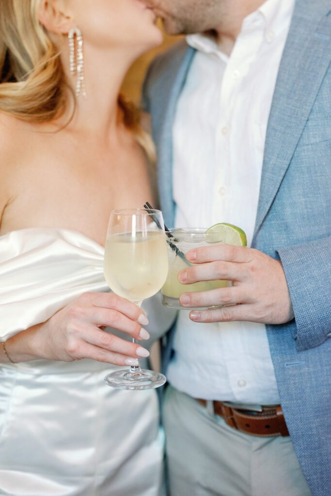 bride and groom holding cocktails at Poogan's Porch in Charleston