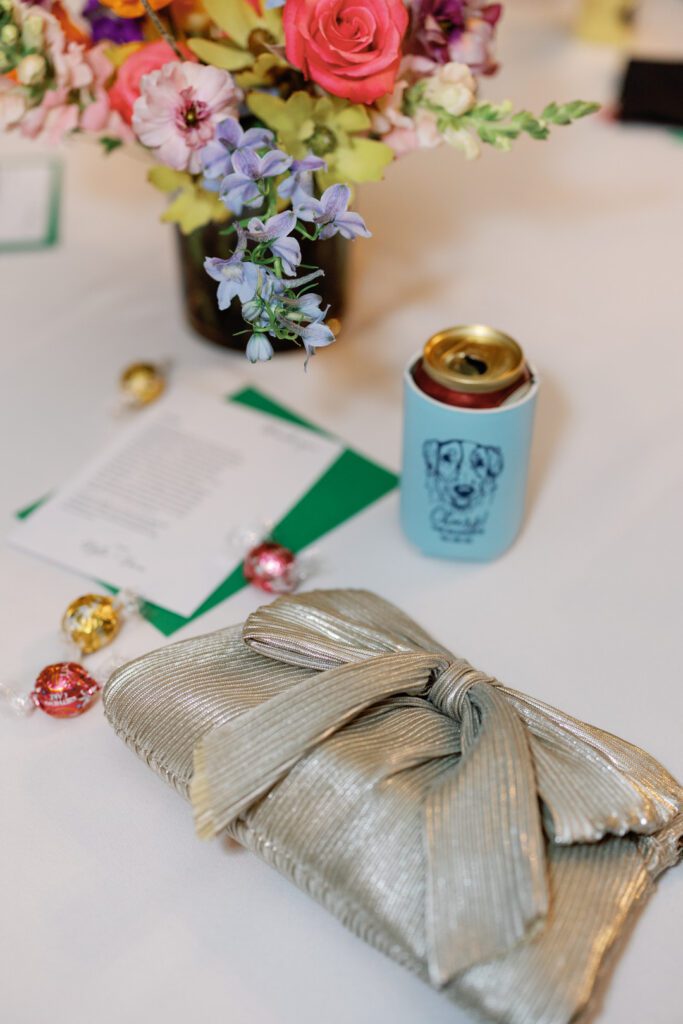 Purse with beer in coozie