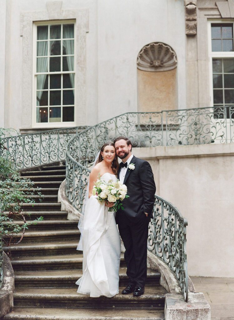 bride and groom on Swan House stairs