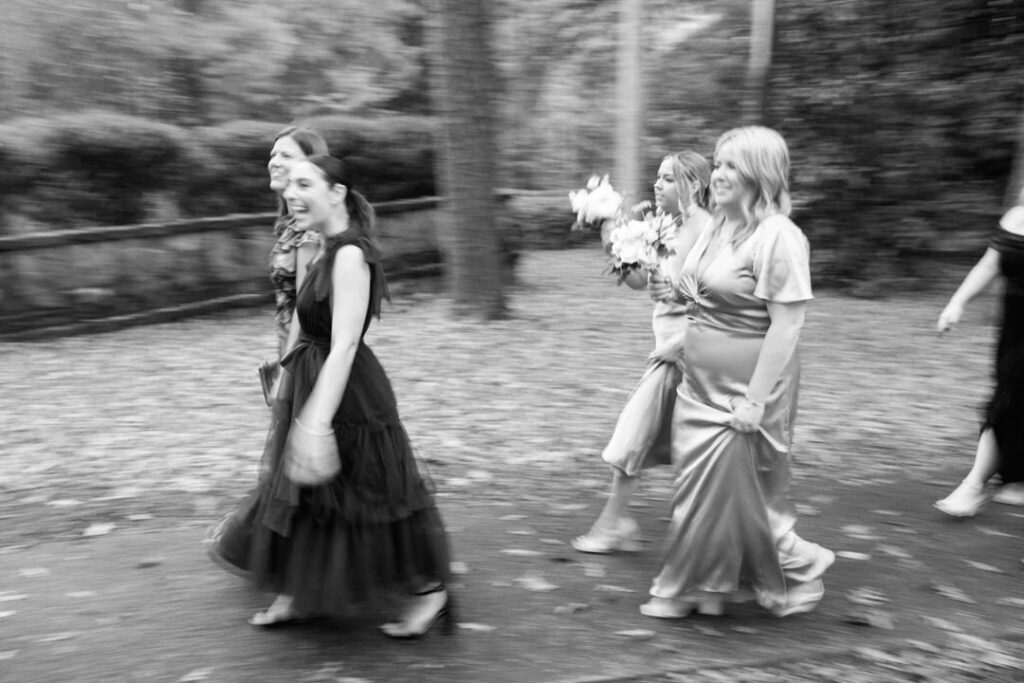 black and white of bridesmaids walking