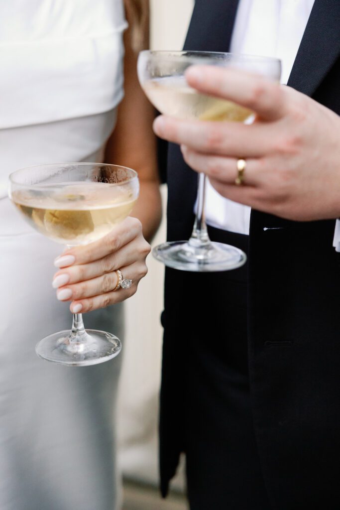 bride and groom holding martinis