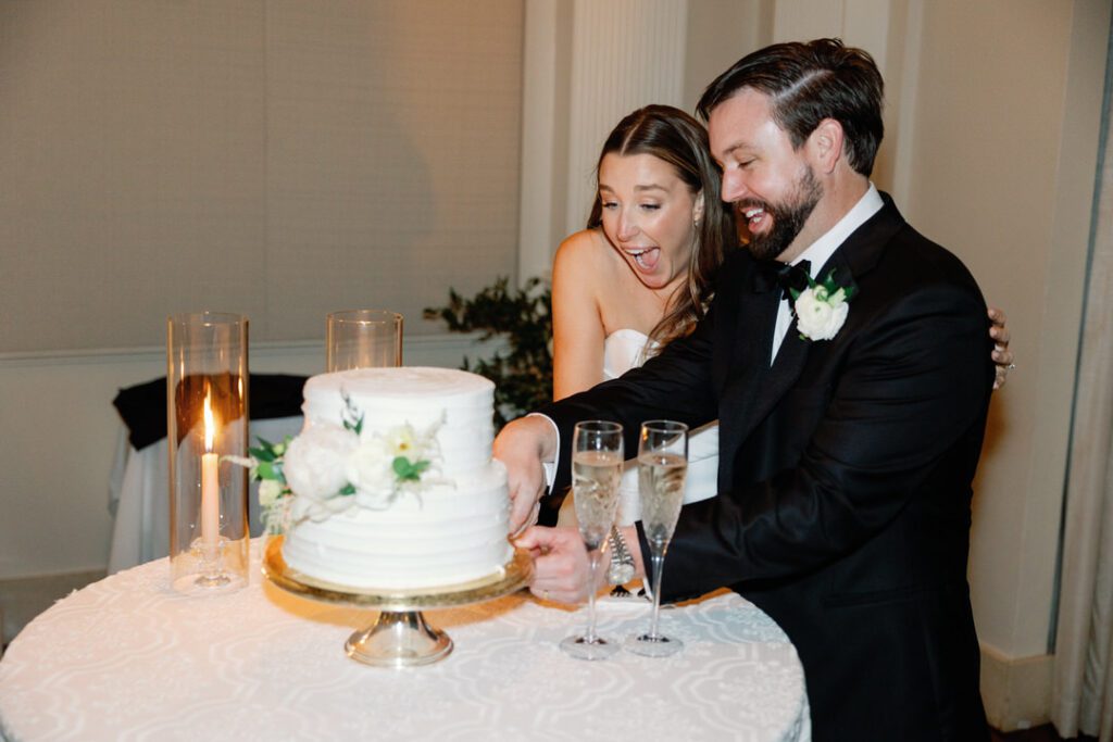 bride and groom cutting cake