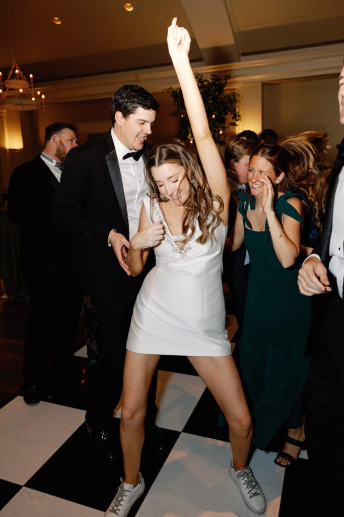 bride dancing with wedding guests