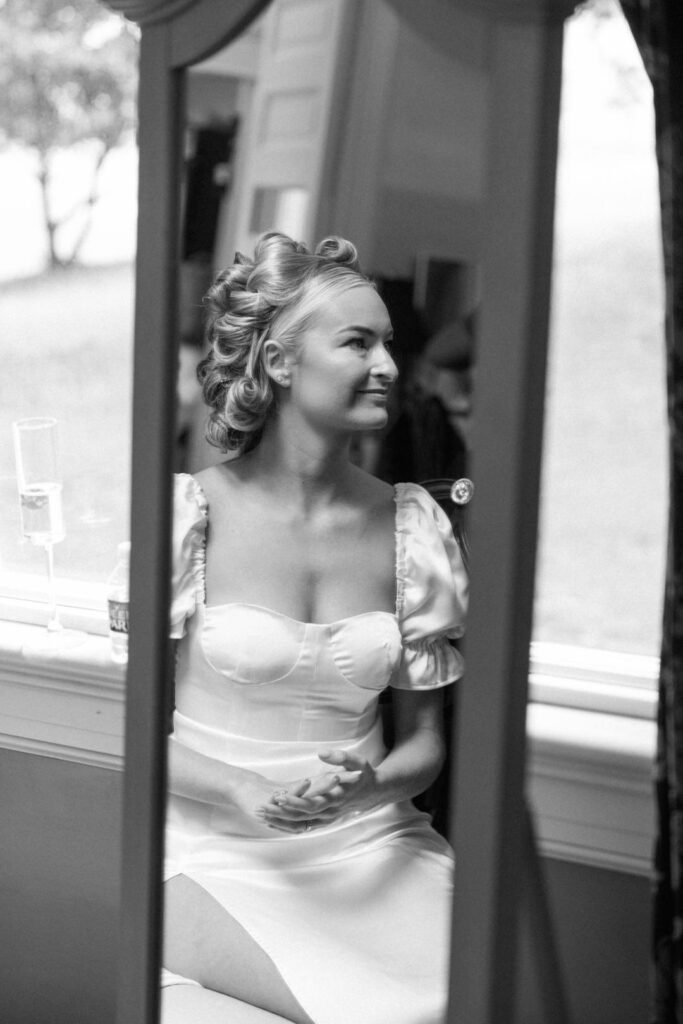 black and white of bride getting ready