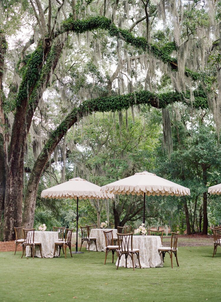 Cocktail hour tables with umbrellas at The Admiral's House