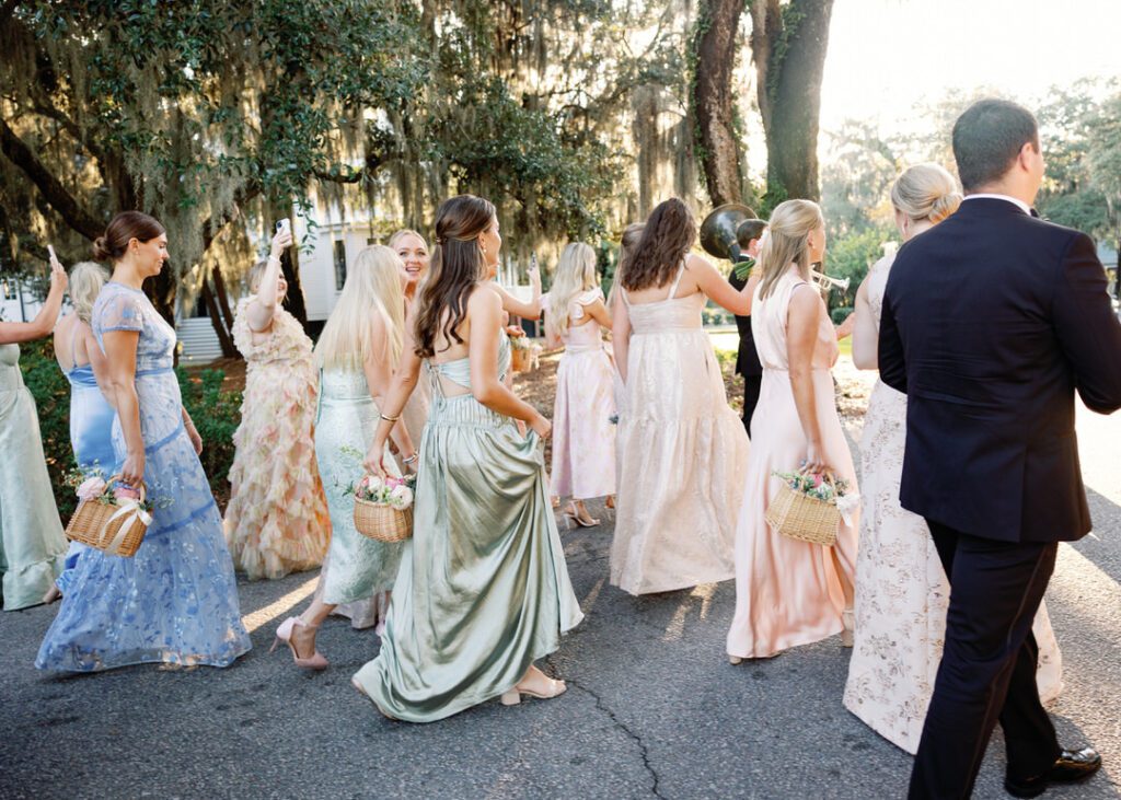 wedding guest second line marching to wedding cocktail hour