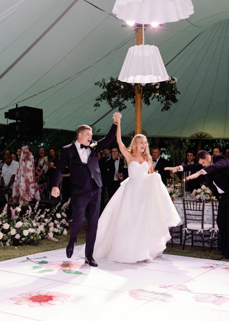 bride and groom entering wedding reception