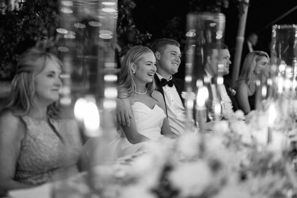 black and white of bride and groom at wedding reception