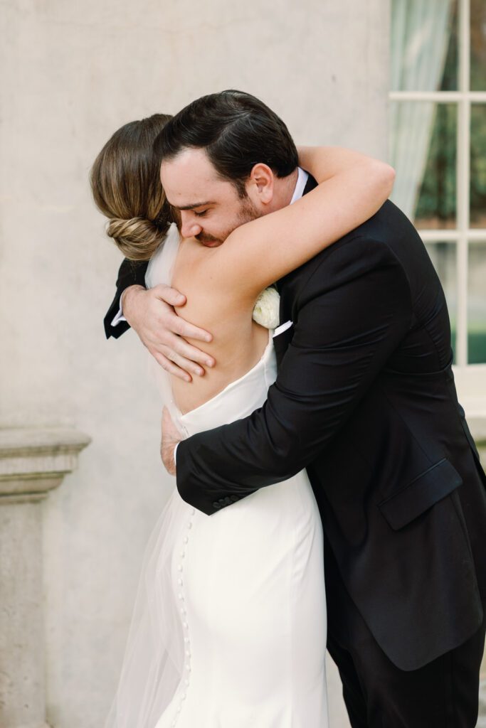 bride and groom hugging