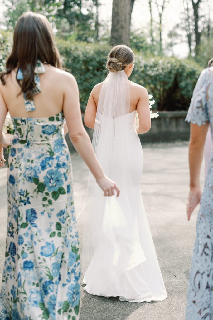 bride walking with bridesmaids