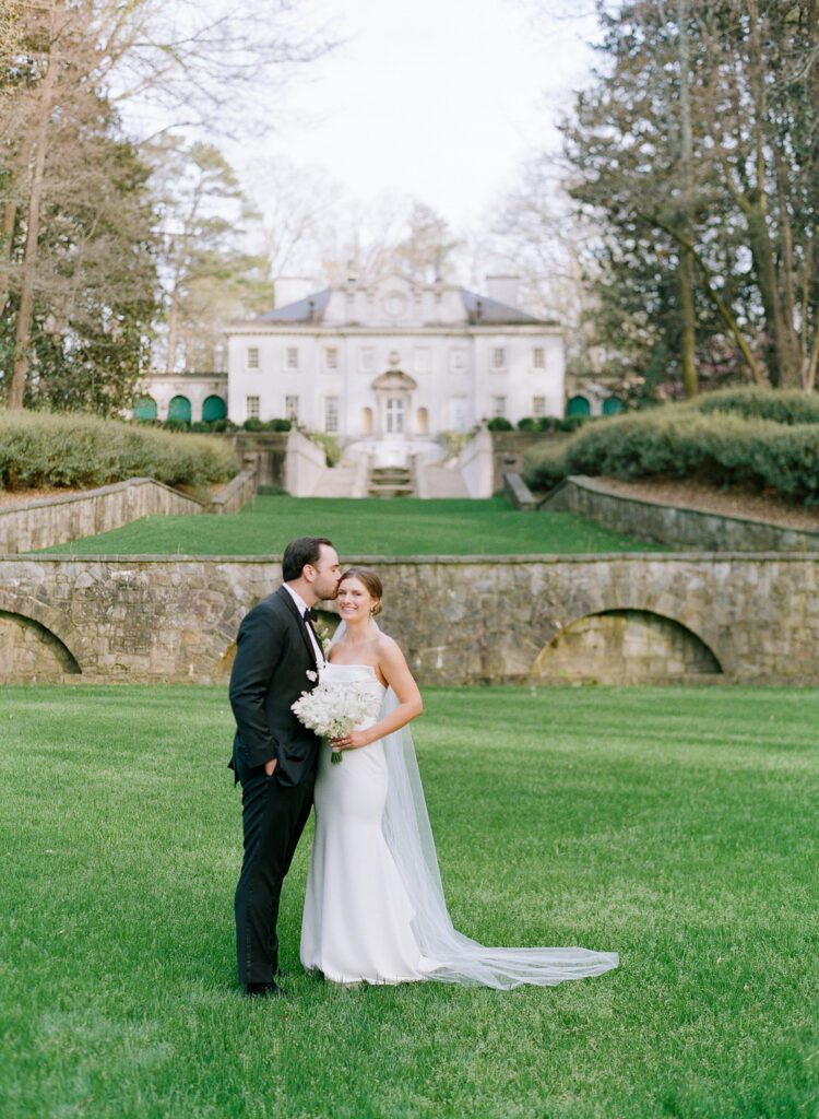 groom kissing bride