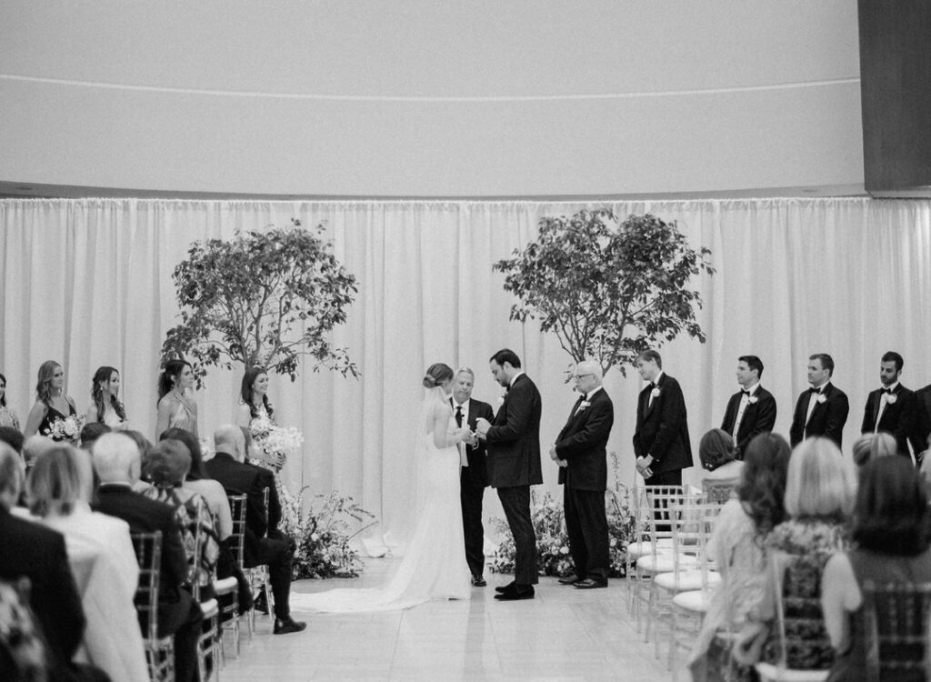 black and white of bride and groom wedding ceremony