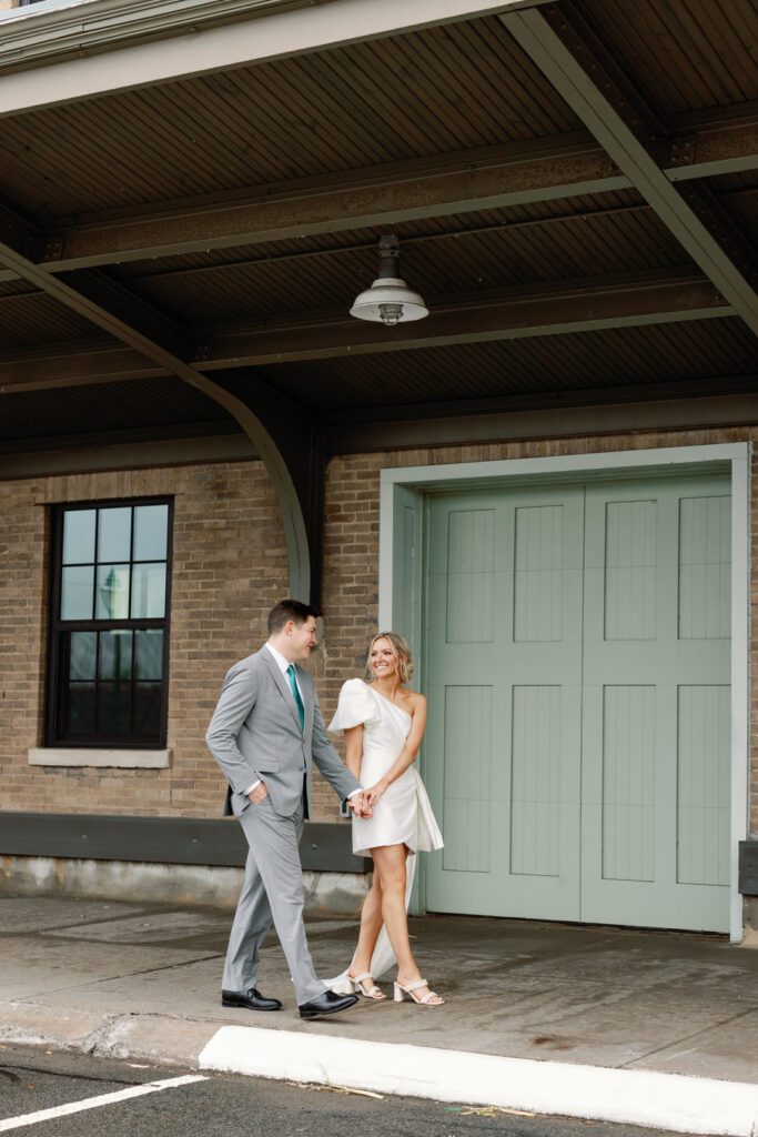 bride and groom walking holding hands