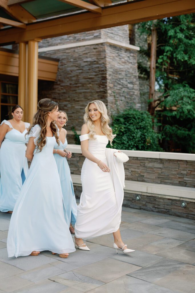 bride walking with bridesmaids