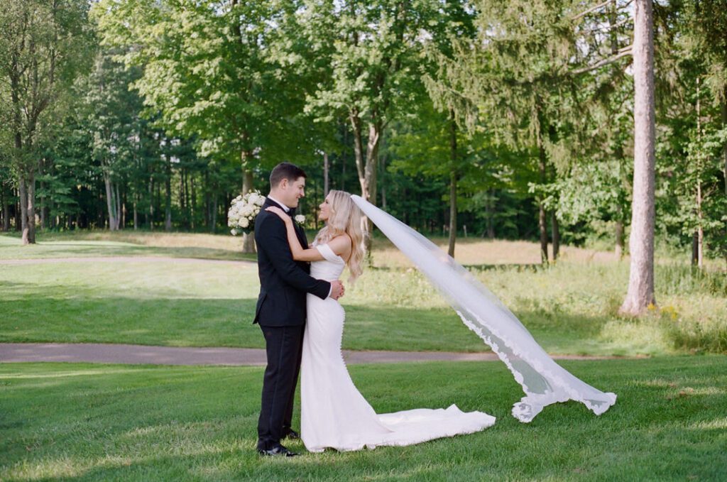 bride and groom hugging