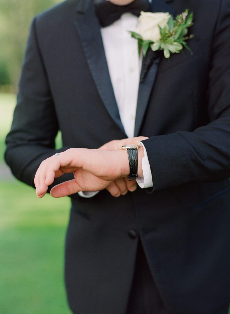 groom looking at watch