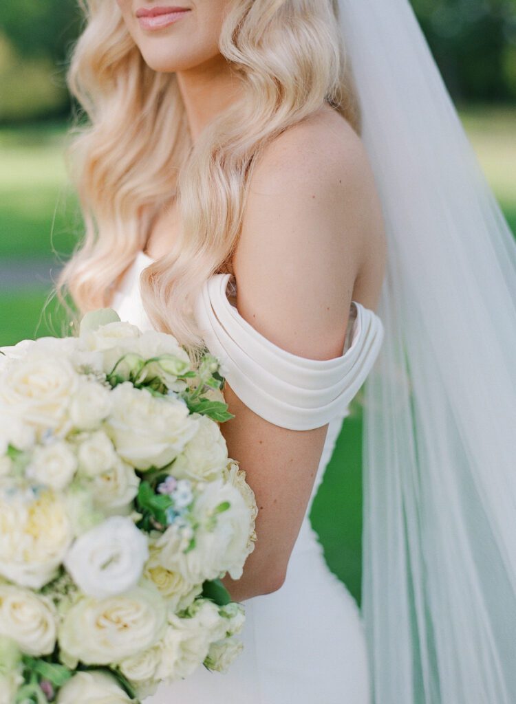 brides sleeve and bouquet