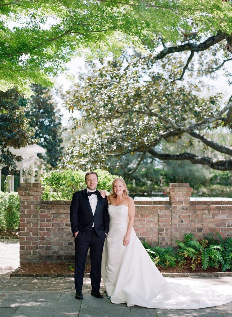 bride and groom smiling at camera