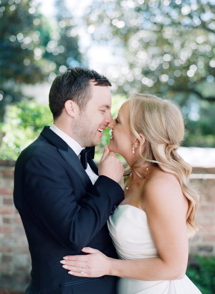 bride and groom nose to nose