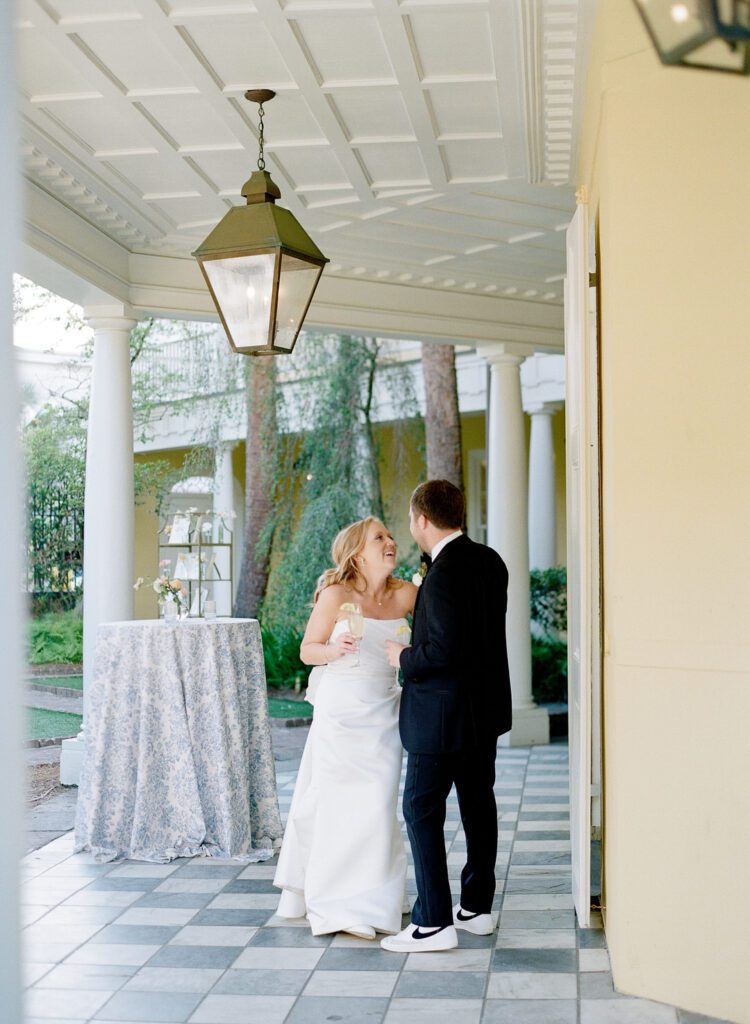 bride and groom laughing with each other