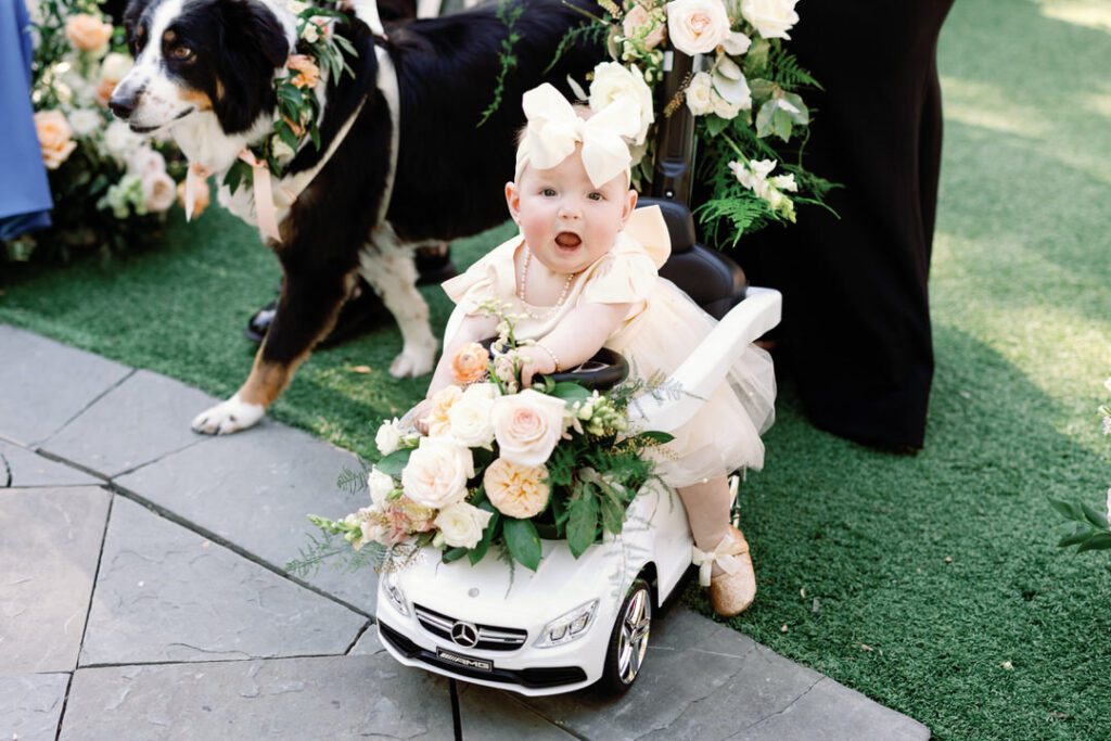 flower girl on a tiny Mercedes Benz