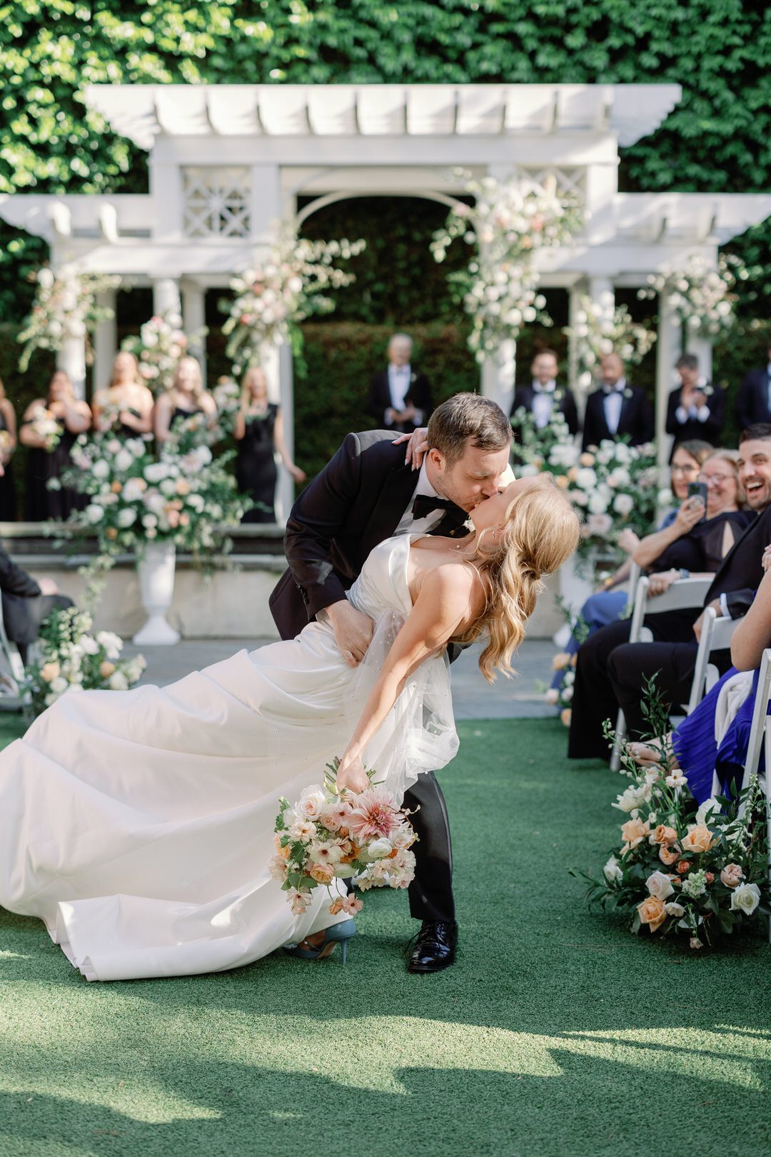 bride and groom exiting ceremony kiss