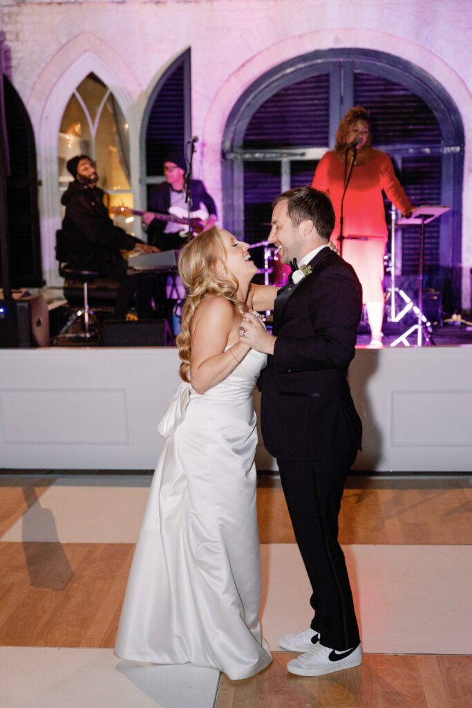 bride and groom laughing first dance