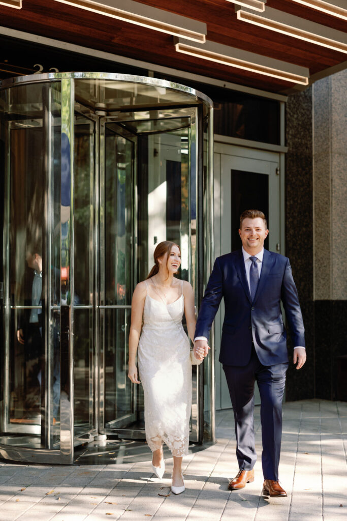 Bride and Groom walking to rehearsal dinner