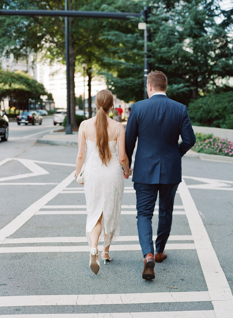 bride and groom walking through atlanta