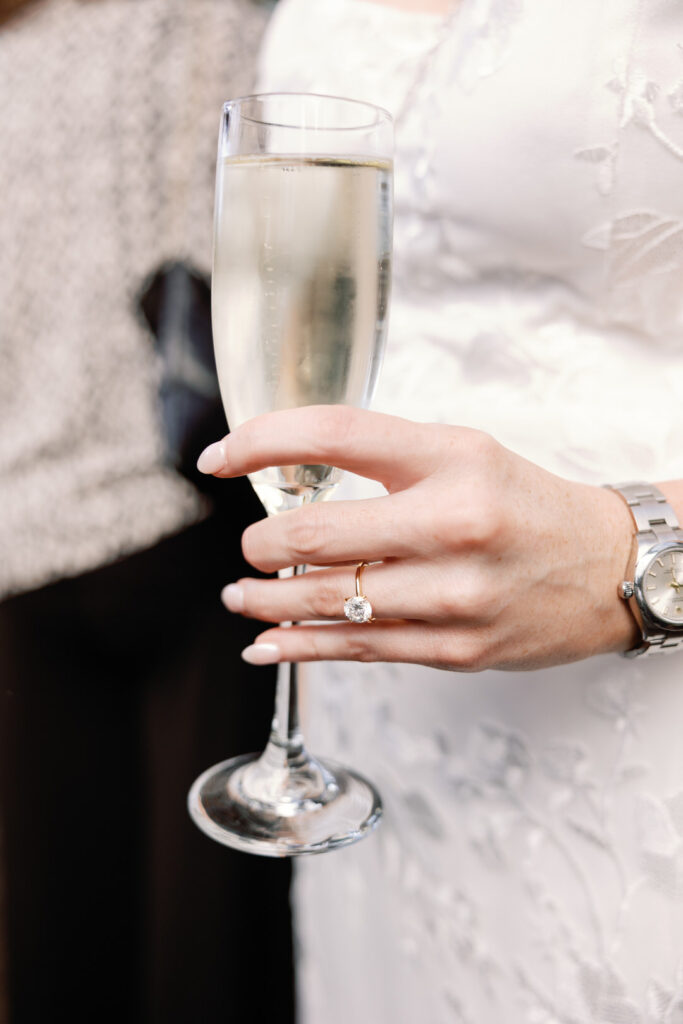 bride holding champagne glass