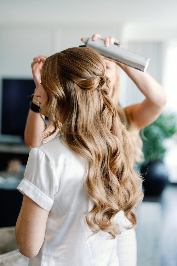 bride getting makeup and hair done