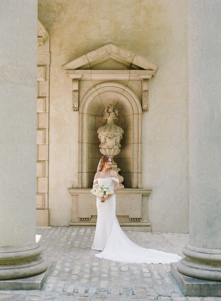 bride holding bouquet looking off