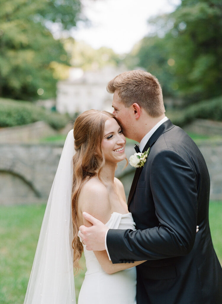 bride and groom laughing together