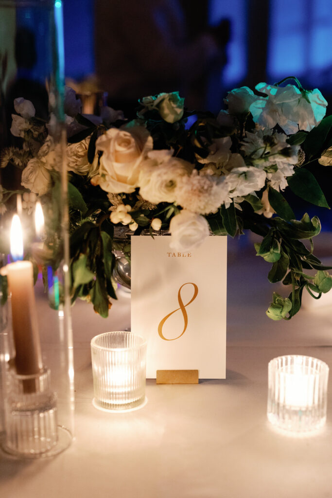 wedding reception table with number and candle