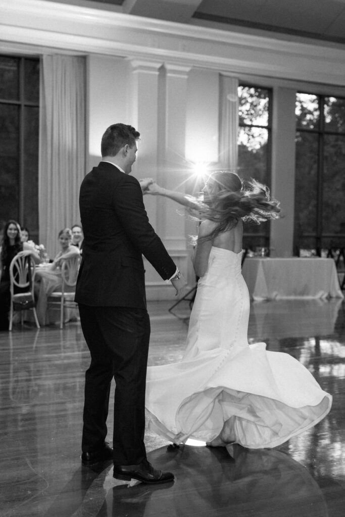 black and white of bride and groom first dance