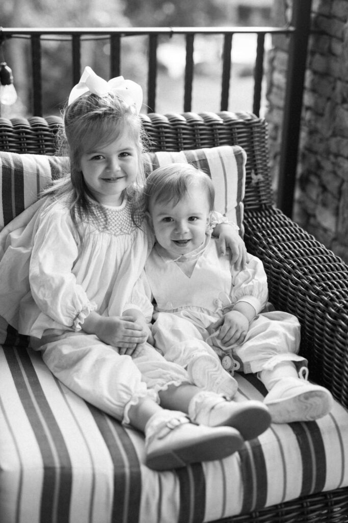 black and white of flower girl and her brother