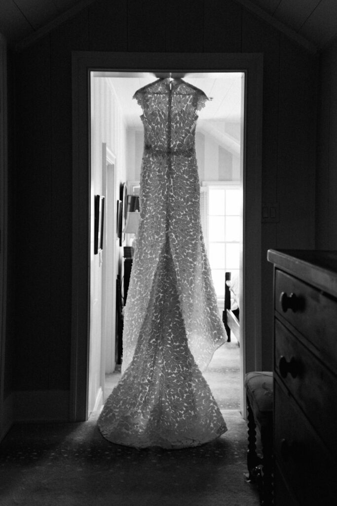 black and white of brides dress hanging