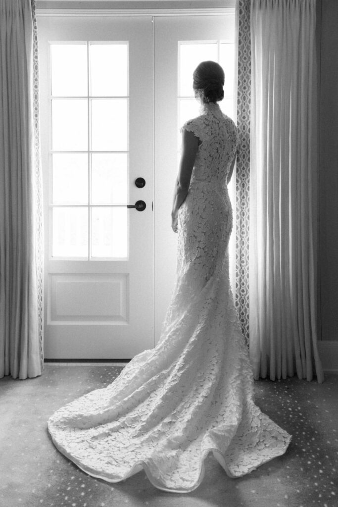 black and white of bride getting ready