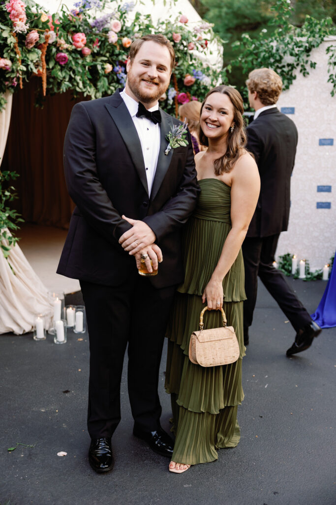 wedding guests at entrance of wedding reception tent