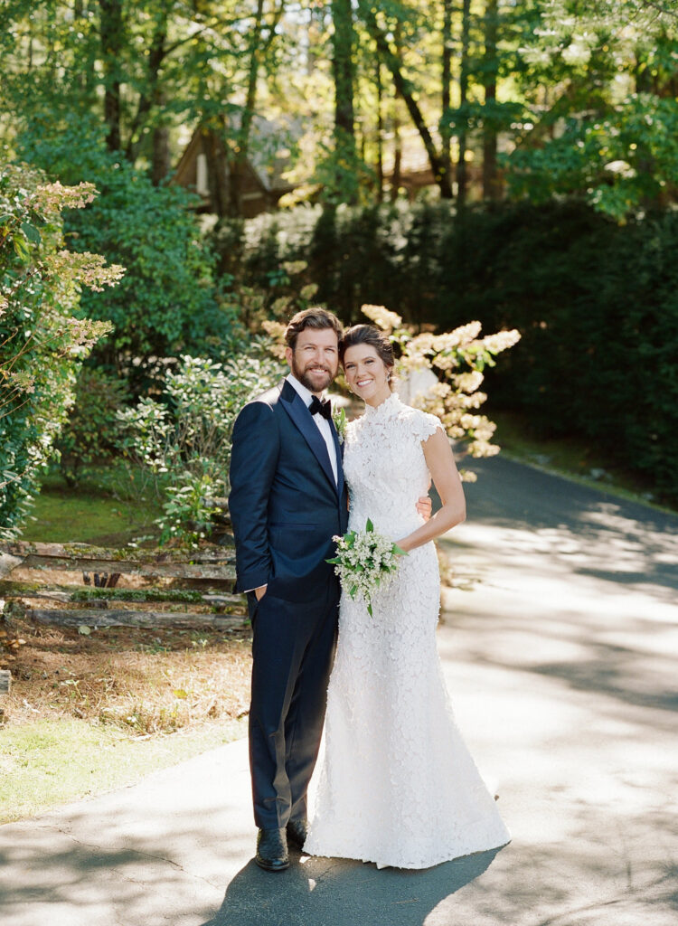 bride and groom smiling at camera