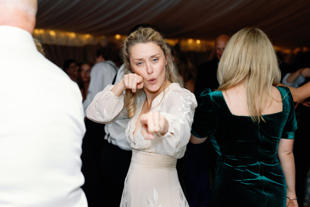 wedding guest dancing at reception