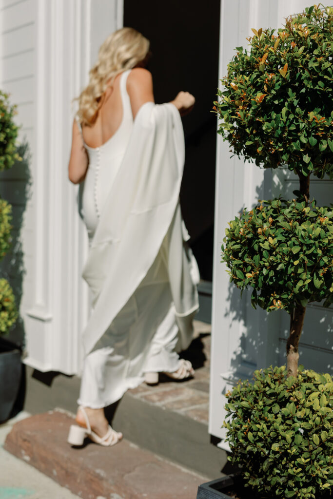 bride walking through doorway