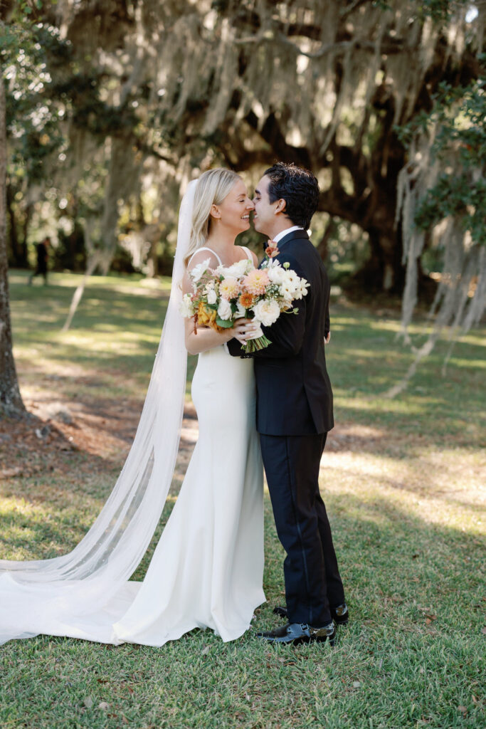 bride and groom hugging almost kissing